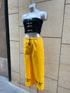PANTALÓN BAKA AMARILLO LETRAS NEGRAS