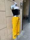 PANTALÓN BAKA AMARILLO LETRAS NEGRAS